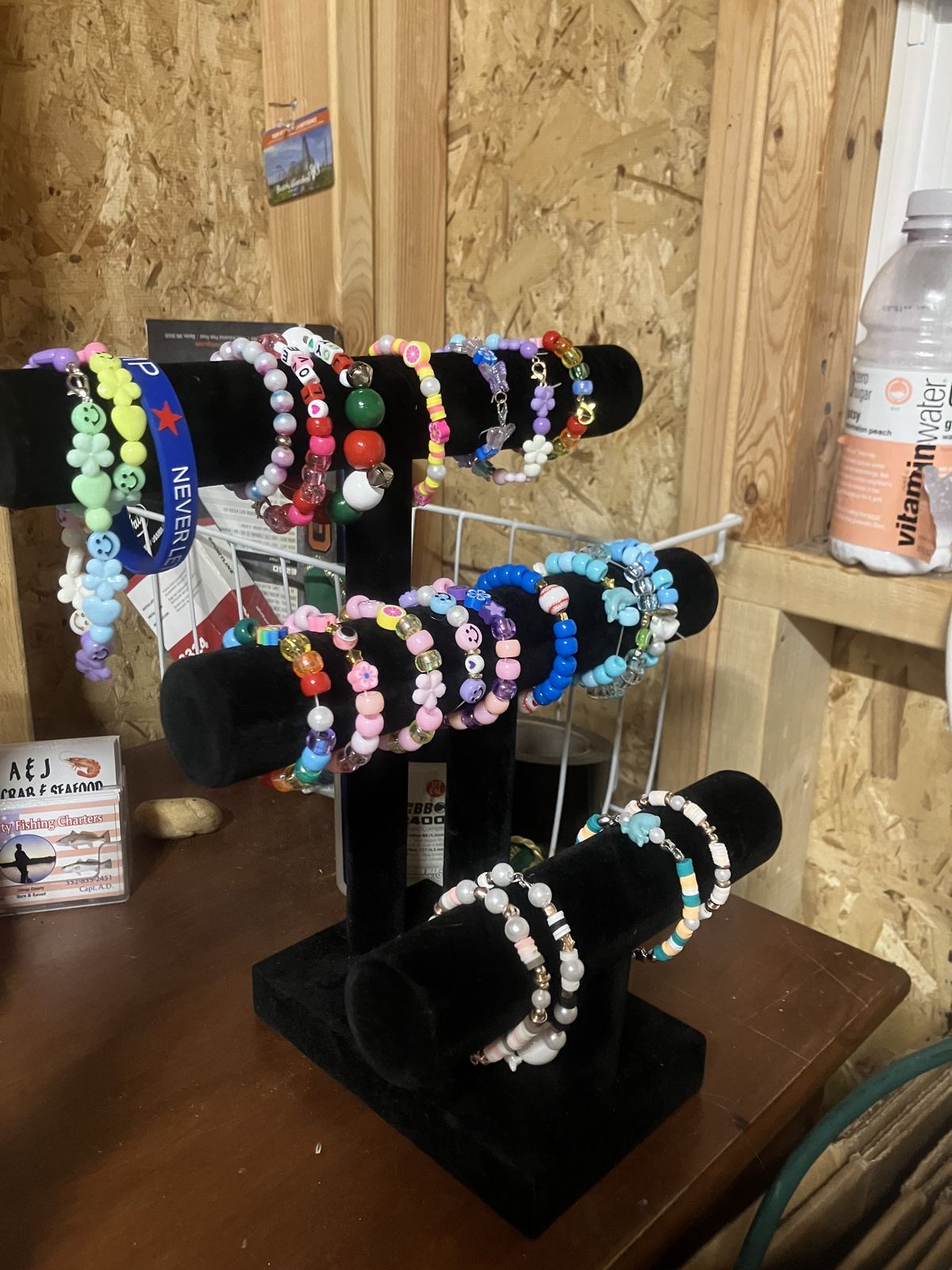 Handmade beaded bracelets on display stands